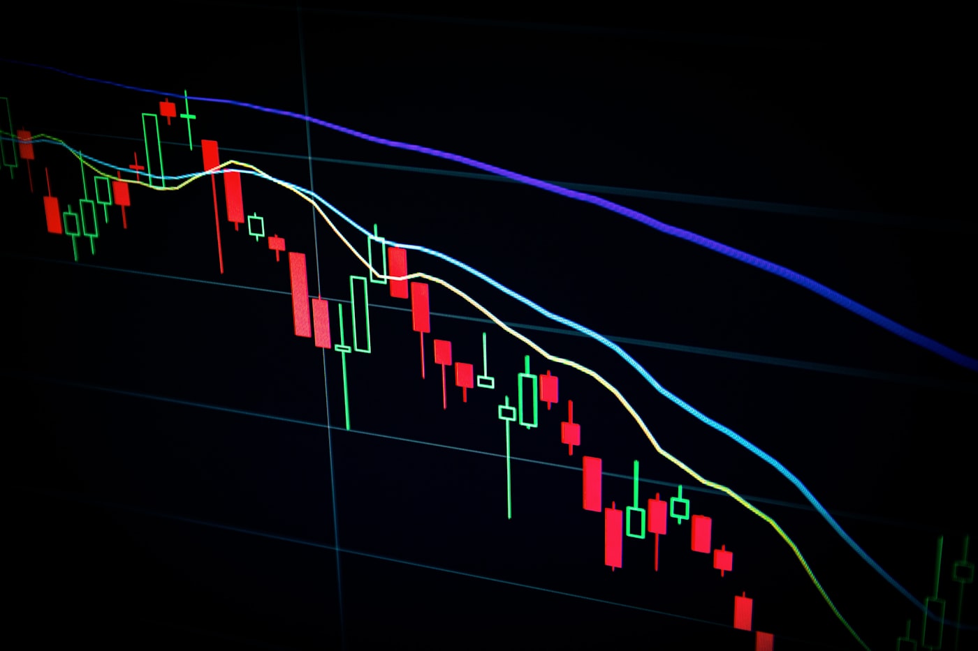 Trader Monitoring Multiple Screens During High Volatility